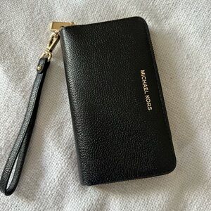 NWOT Michael Kors leather wallet with wrist strap.  Black.  Never used.